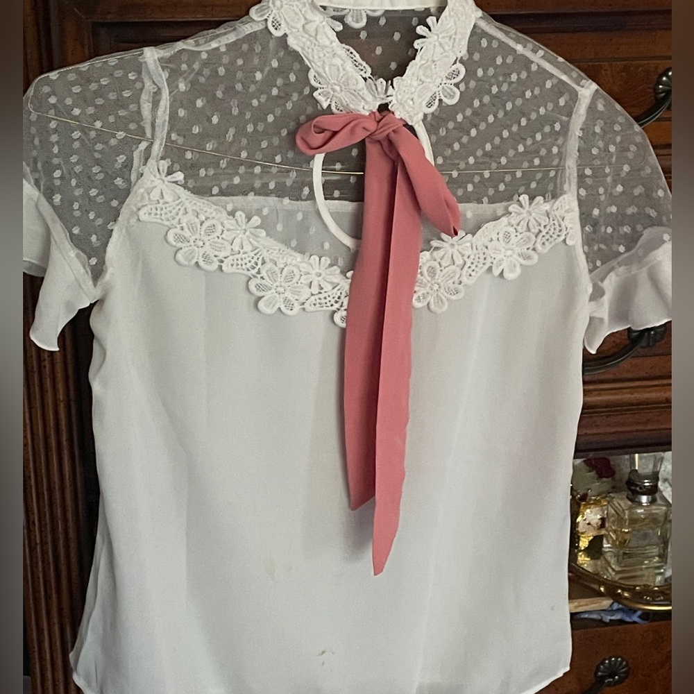 white lace blouse with pink bow